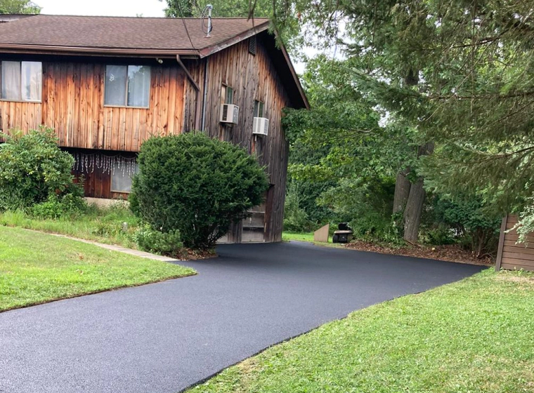 old house with newly installed asphalt driveway piscataway nj
